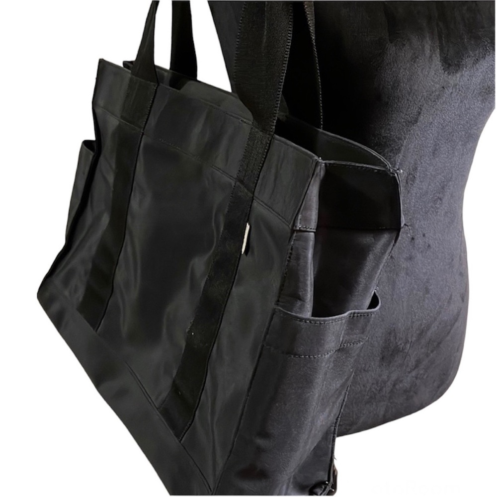 Old Navy Black nylon tote bag. Great pockets and compartments. Sturdy Strap - Picture 1 of 12